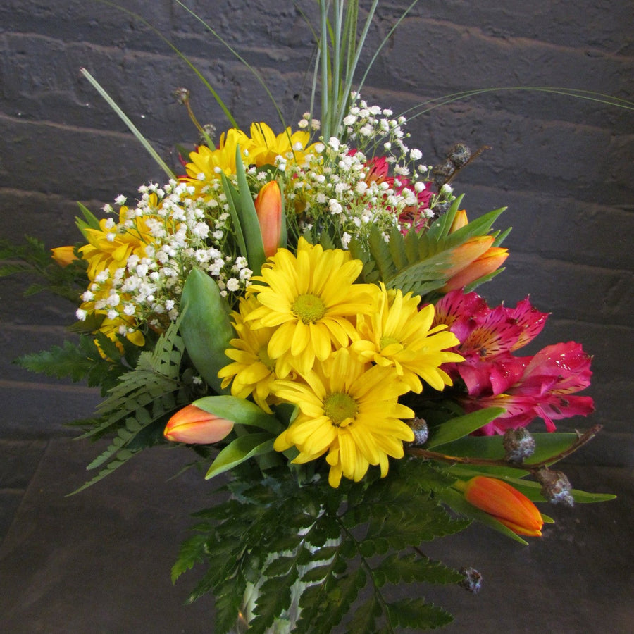 Spring flower bouquet in glass vase.