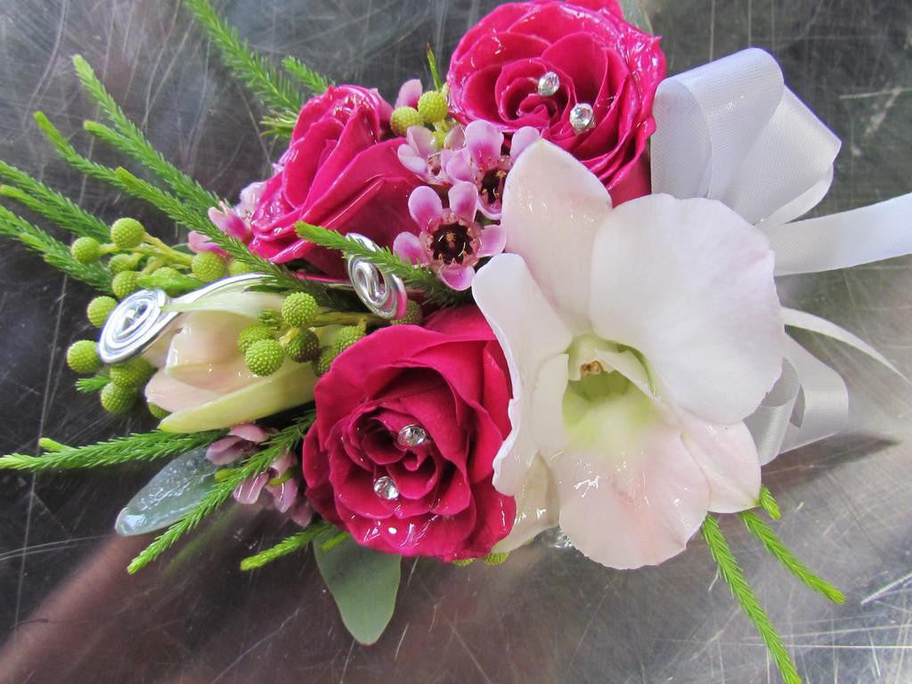 Prom corsage with roses, orchid, and ribbon