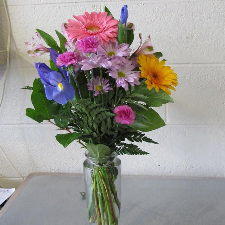 Fresh spring flower bouquet in glass vases