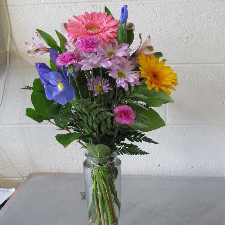 Fresh spring flower bouquet in glass vases